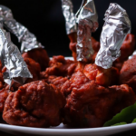 Eateries across Mumbai and Maharashtra are dropping bright artificial red and pink dyes from popular street foods like chicken lollipops, Manchurian, and cotton candy. This shift follows intensified surprise inspections and strict enforcement by the Maharashtra Food and Drug Administration (FDA) targeting unpermitted chemical additives and poor kitchen hygiene.